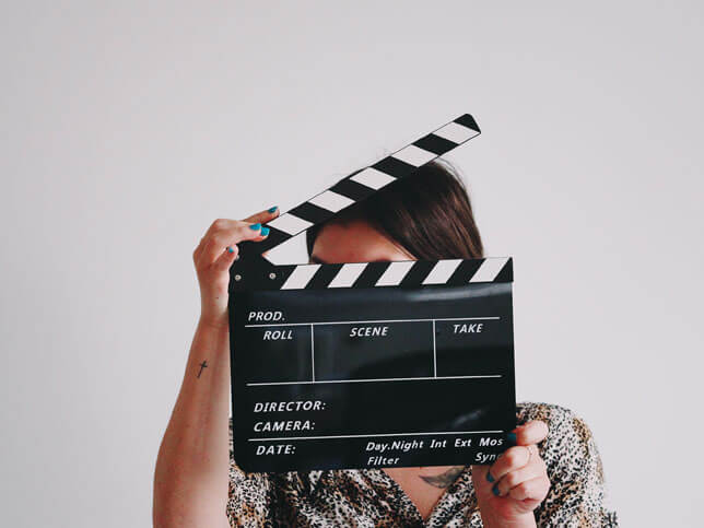 Woman holding film slate